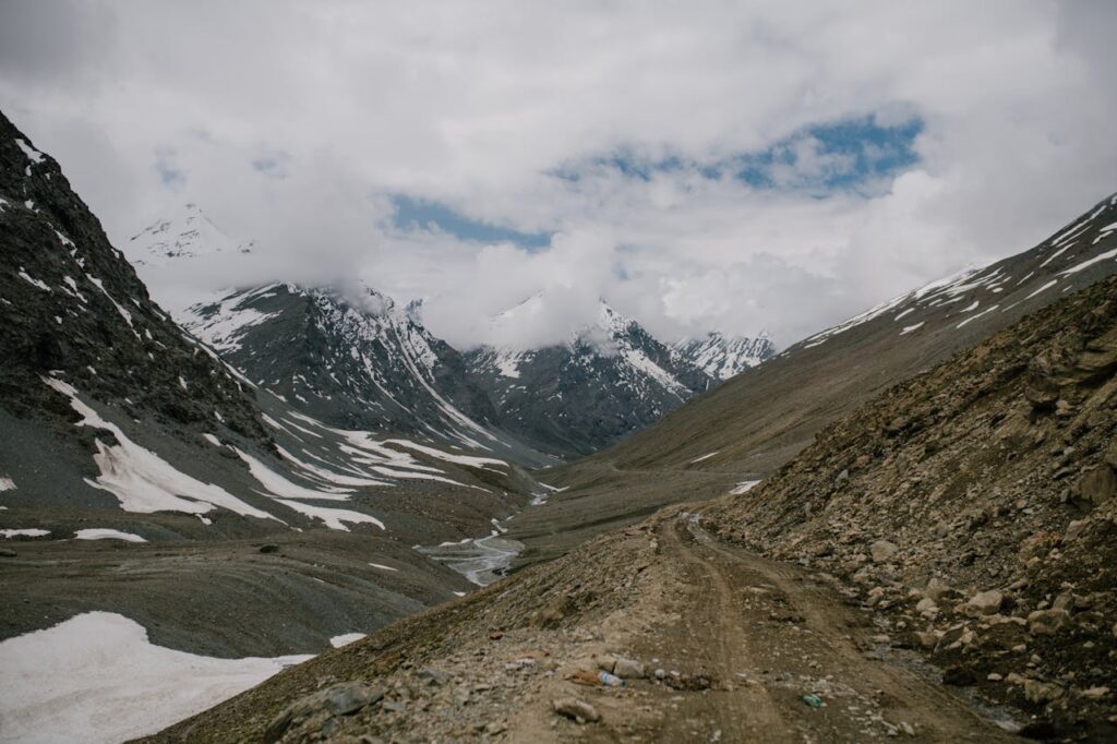 Cloudy sky over snowy mountain range